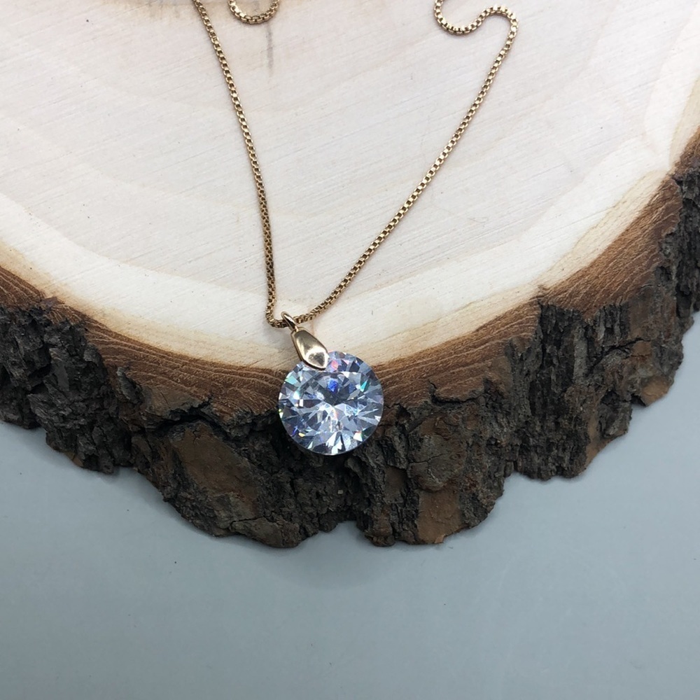 Gold tone dainty chain dazzling sparkling CZ pendant necklace.